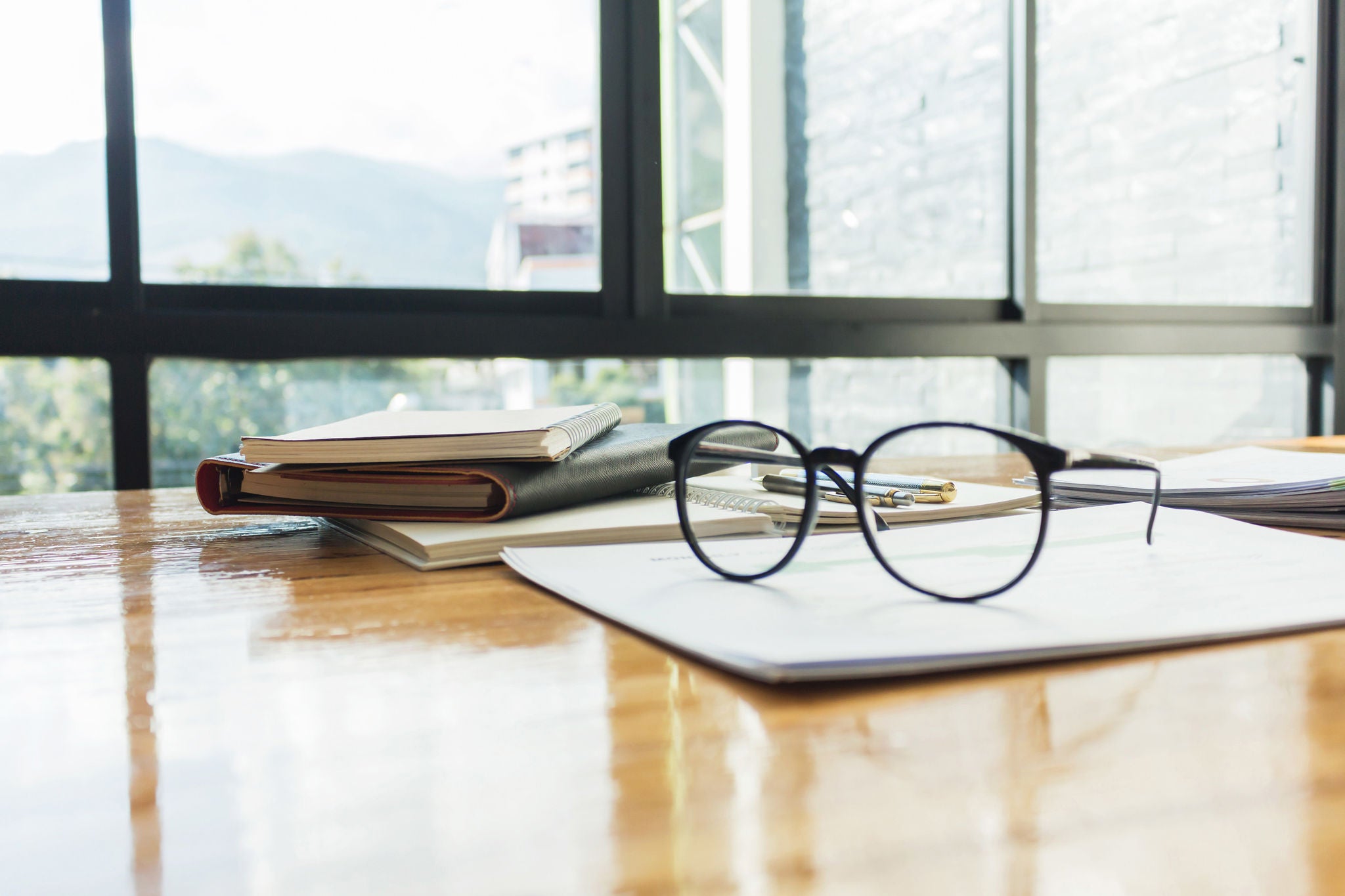 Glasses with documents on the table