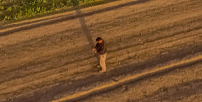 Man standing in a plowed field