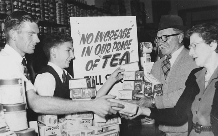 <p>Customers buying up tea before the price rise, Brisbane,&nbsp;Australia, 1954 (via <a href="https://commons.wikimedia.org/wiki/File:StateLibQld_1_114936_Customers_buying_up_tea_before_the_price_rise,_Brisbane,_1954.jpg">Wikimedia Commons</a>)</p>