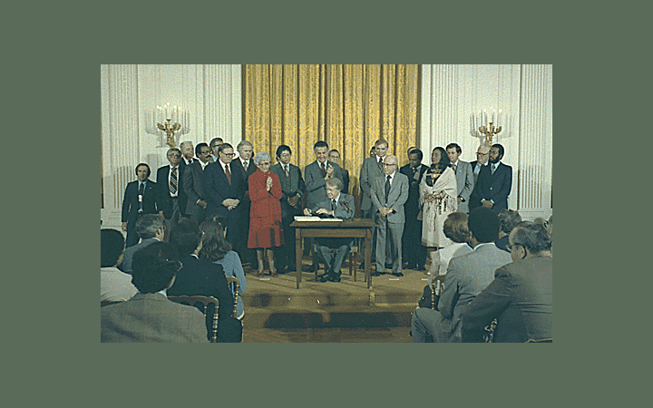 <p>Jimmy Carter signs the Humphrey-Hawkins Bill, October 27, 1978 (via Jimmy Carter Library and National Archives and Records Administration, <a href="https://catalog.archives.gov/id/1d82117">NAID 182117</a>)&nbsp;</p>