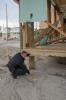 Patrolman points out the original height of the sand on this house before Hurricane Sandy made landfall. FEMA is working with many partners and organizations to assist residents affected by Hurricane Sandy. Photo by Liz Roll/FEMA