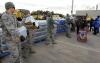 New York residents pick up water from the National Guard after Hurricane Sandy. 