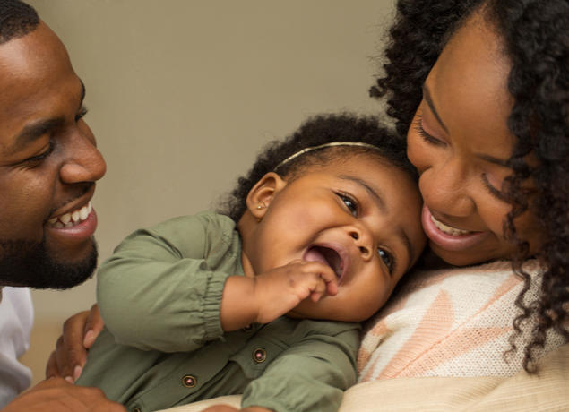 Happy baby with parents