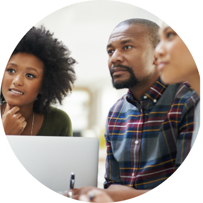 Black man and women sitting around a computer