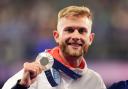 Great Britain’s Josh Kerr with his silver medal following the men’s 1500 metres final at the Stade de France (Martin Rickett/PA).