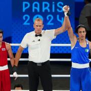 Imane Khelif, right, has dismissed the gender row after reaching the women’s welterweight final (Peter Byrne/PA)