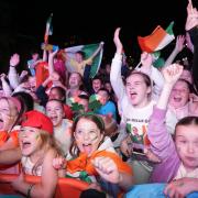 Fans celebrate as they watch Kellie Harrington’s boxing final (Niall Carson/PA)