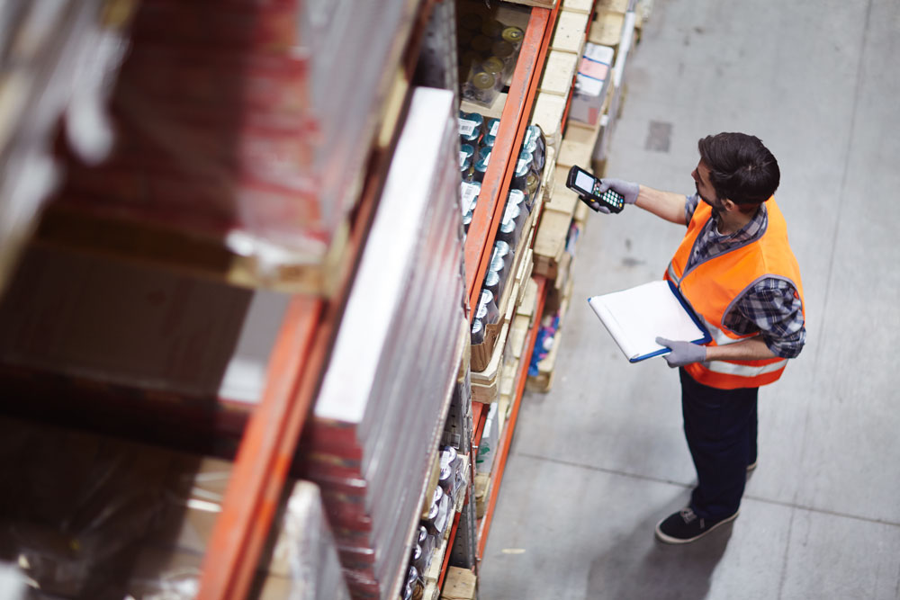 GroupBy eCommerce search & product discovery case study - warehouse worker walkthrough stocked shelves looking for product from online order