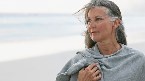 Adult woman outdoors trying to strengthen her willpower gainst substance use disorders.