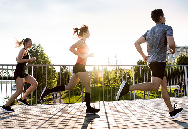 three people running outdoors