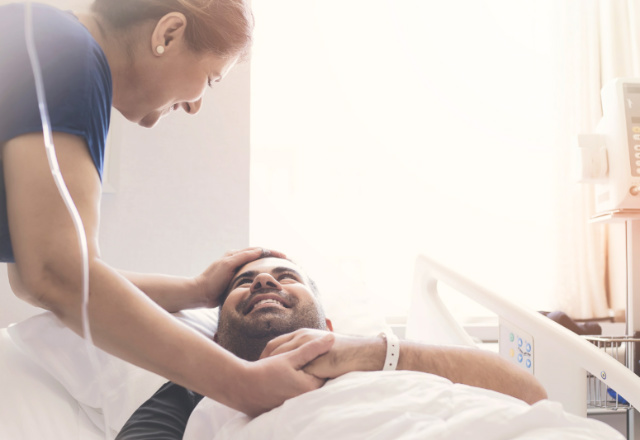 loved one looking down at patient - heart and vascular institute