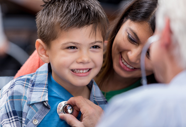 boy smiling at doctor - heart and vascular institute