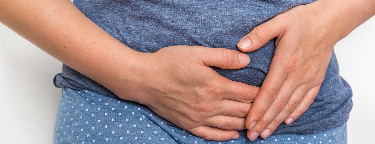 woman holding gut