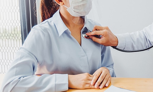 doctor listening to patient's chest - stay on top of your heart health