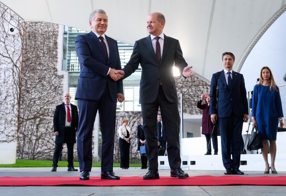 German Chancellor Olaf Scholz (R) welcomes Shavkat Mirsiyoyev, President of Uzbekistan, in front of the Chancellor's Office in Berlin, Germany, May 2, 2023.