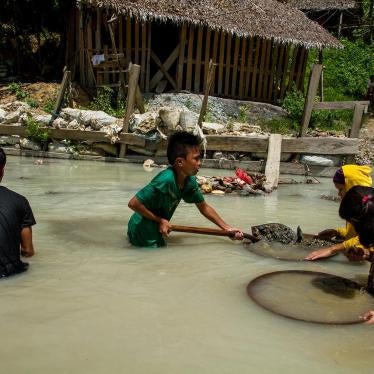 Children pan for gold