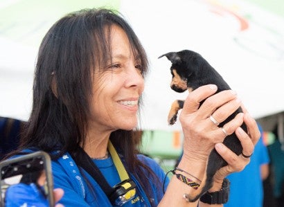 Woman holding a small dog