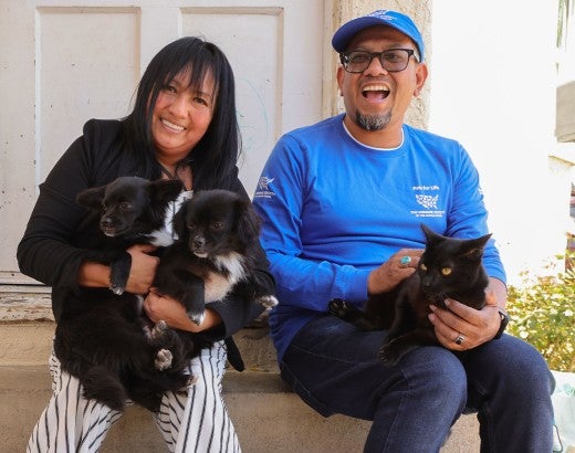 Pets for Life team meets with a recipient during a ride along clinic