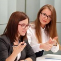 Two Female Employers Discussing Health Coverage