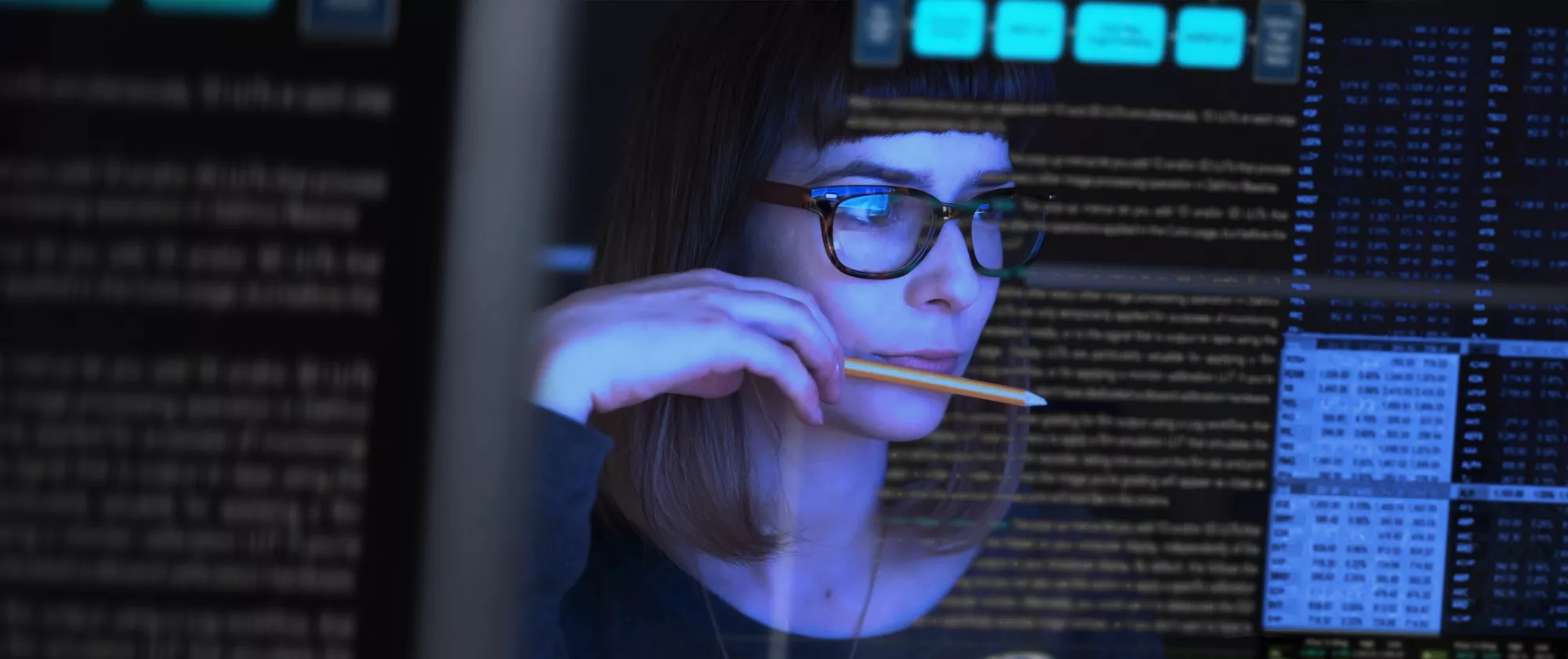 Researcher looking at data on a screen