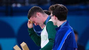 <p>Ireland’s Rhys McClenaghan receives his gold medal during the ceremony for the men’s pommel horse final during the Artistic Gymnastics at the Bercy Arena on the eighth day of the 2024 Paris Olympic Games in France. Picture: Peter Byrne/PA</p>