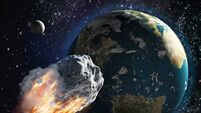 Burning asteroid moving through the Earth