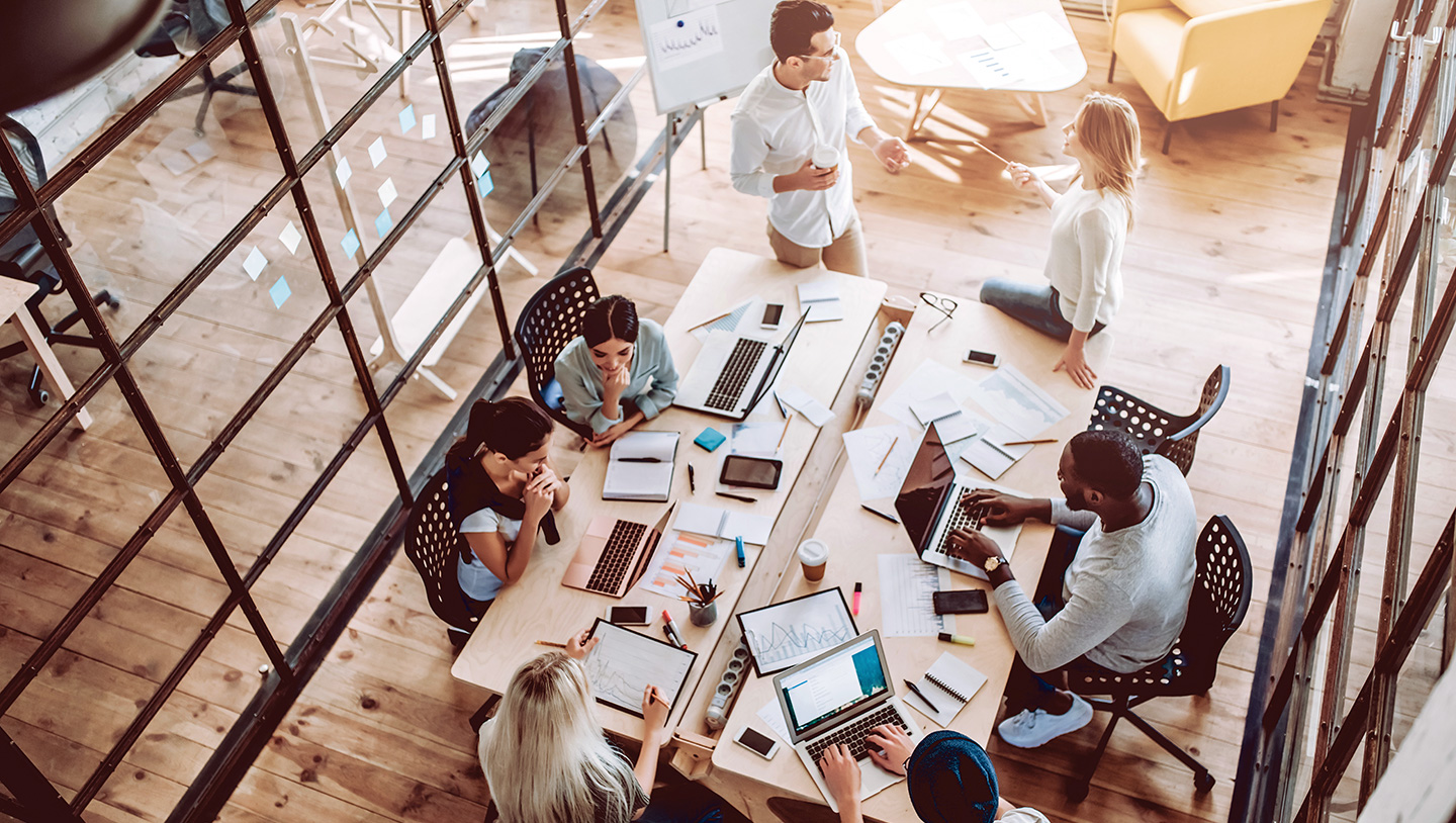 Aerial view of group working at conference table