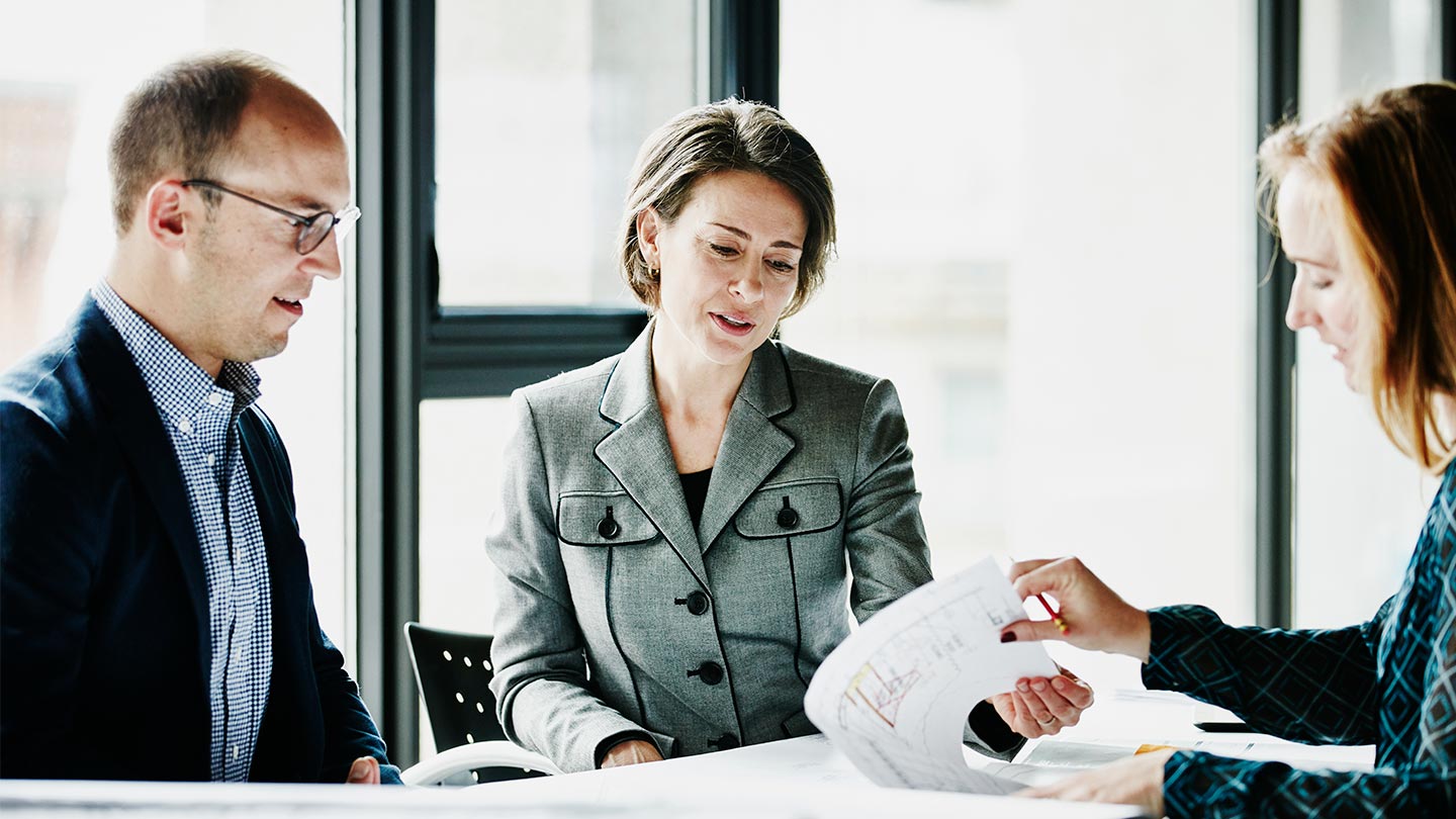 Three business people working 