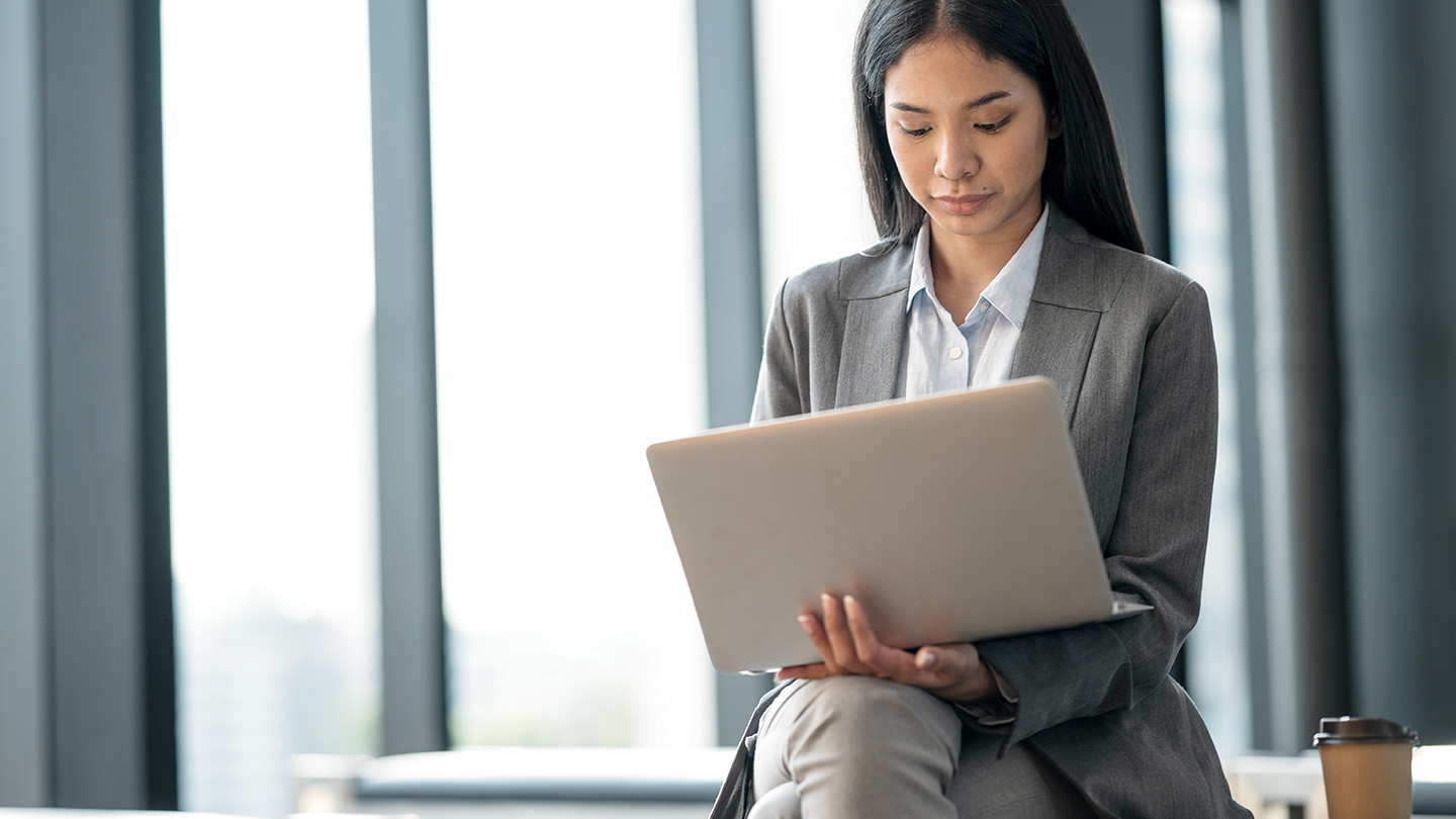 Businesswoman works on her laptop