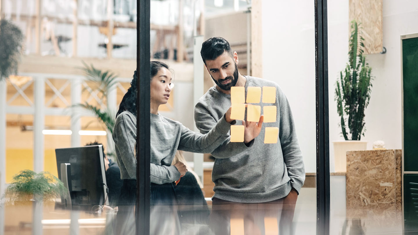 two people in a meeting room