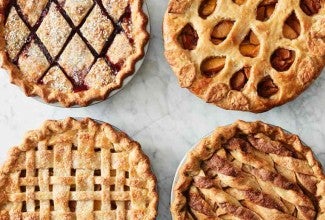 Four pies with decorative top crusts