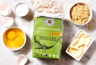 Open bag of Climate Blend flour next to various baking ingredients