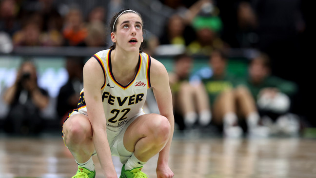 SEATTLE, WASHINGTON - JUNE 27: Caitlin Clark #22 of the Indiana Fever reacts during the fourth quarter against the Seattle Storm at Climate Pledge Arena on June 27, 2024 in Seattle, Washington. NOTE TO USER: User expressly acknowledges and agrees that, by downloading and or using this photograph, User is consenting to the terms and conditions of the Getty Images License Agreement. (Photo by Steph Chambers/Getty Images)