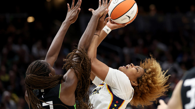 SEATTLE, WASHINGTON - JUNE 27: Ezi Magbegor #13 of the Seattle Storm blocks the shot of NaLyssa Smith #1 of the Indiana Fever during the second quarter at Climate Pledge Arena on June 27, 2024 in Seattle, Washington. NOTE TO USER: User expressly acknowledges and agrees that, by downloading and or using this photograph, User is consenting to the terms and conditions of the Getty Images License Agreement. (Photo by Steph Chambers/Getty Images)