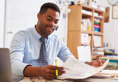 Professional looking over documents.