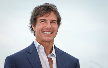 Tom Cruise ici au Festival de Cannes (Alpes-Maritimes) en 2022. Il est question que le comédien, connu pour réaliser ses propres cascades, descende en rappel sur la façade du Stade de France pour récupérer le drapeau olympique. LP/Fred Dugit