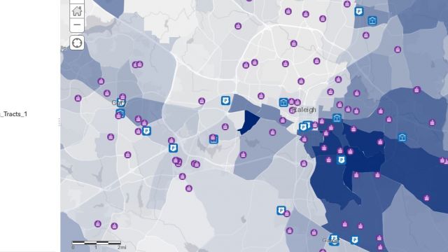 Student-created map showing the locations of some public resources (police stations, public schools, and libraries) against a map that shows what percentage of minorities in each area are cost-burdened due to housing expenses.