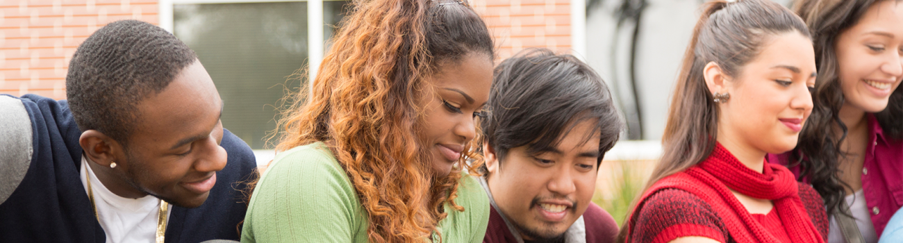 Group of diverse students studying outside