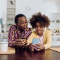 Grandmother and granddaughter with credit card.