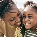 Mother and daughter together smiling