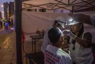 Treating people injured during the protests in Lima