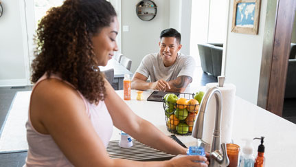 man and woman in the kitchen