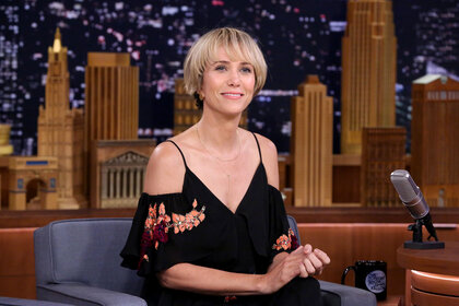 Kristen Wiig smiles during an interview on The Tonight Show