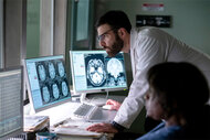 Dr. Wolf (Zachary Quinto) examines x-ray results on a computer monitor on the pilot of Brilliant Minds