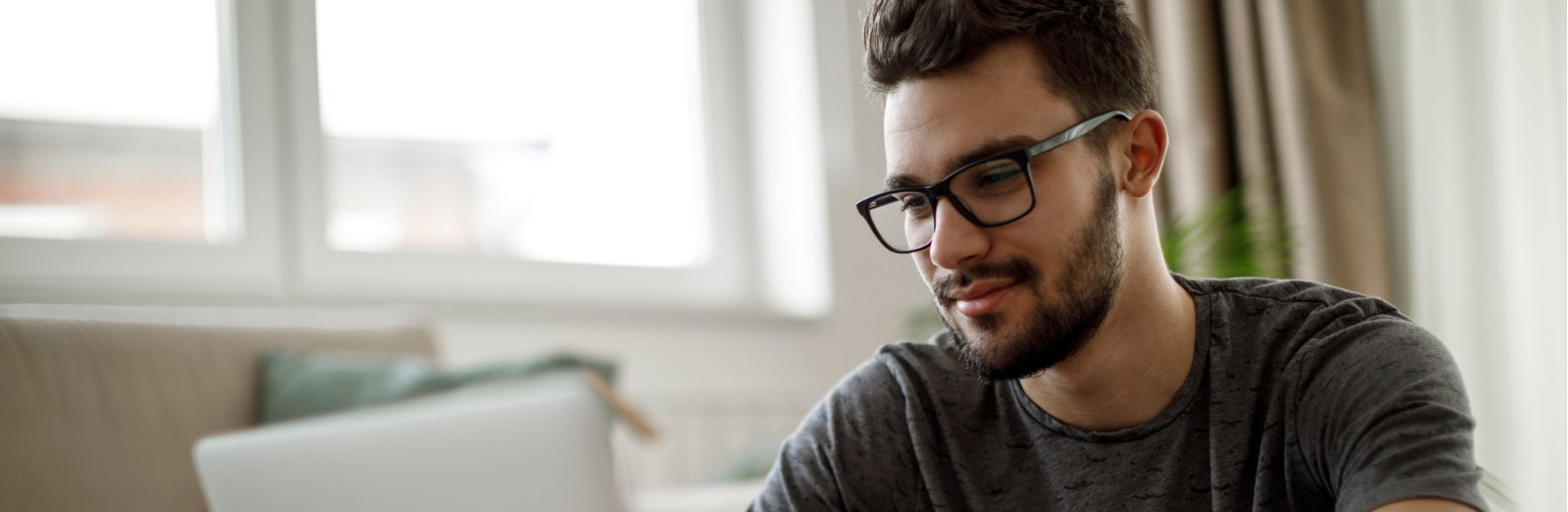 man-using-laptop-at-home-picture-1600x522.jpg