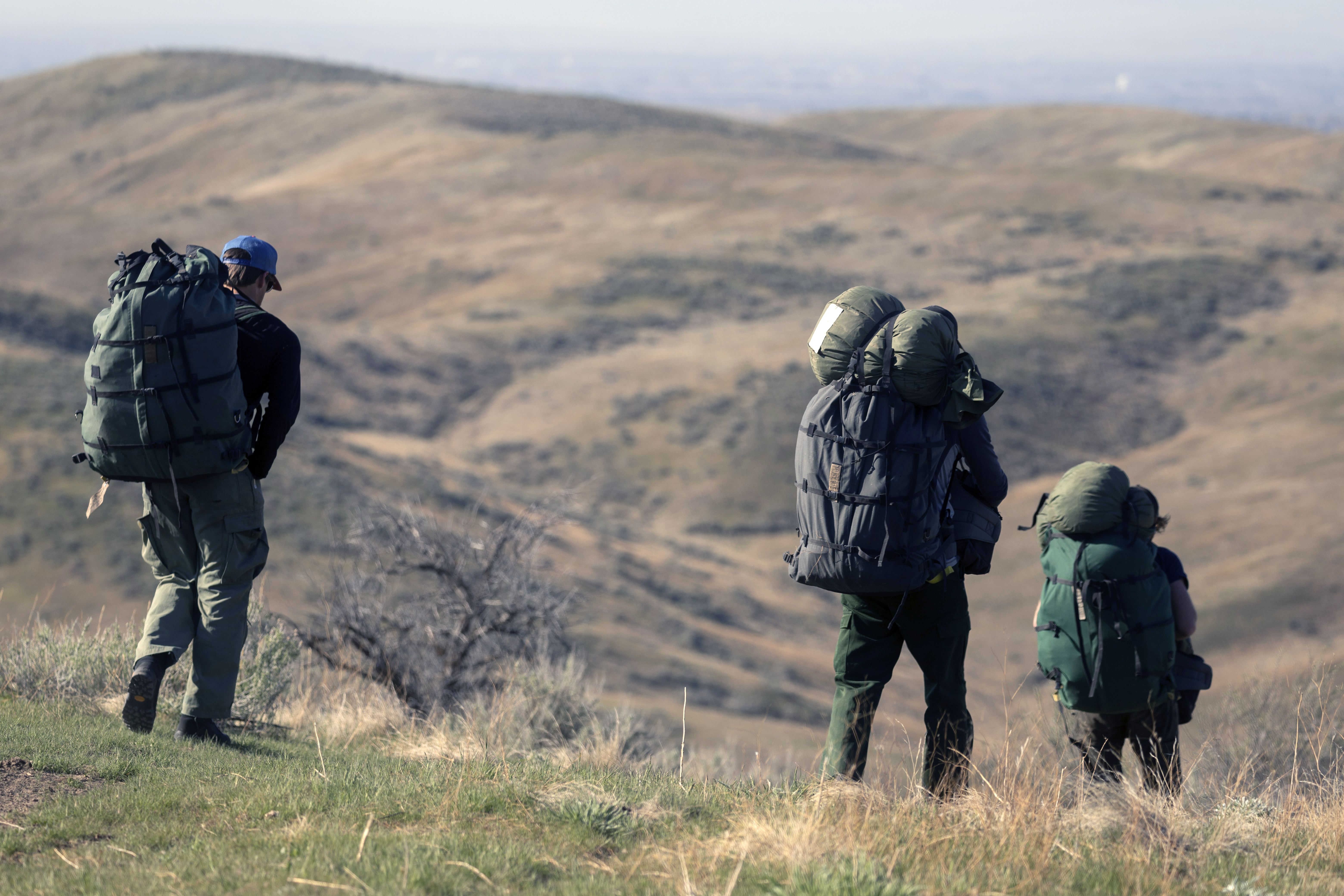 Smokejumpers pack out their gear.