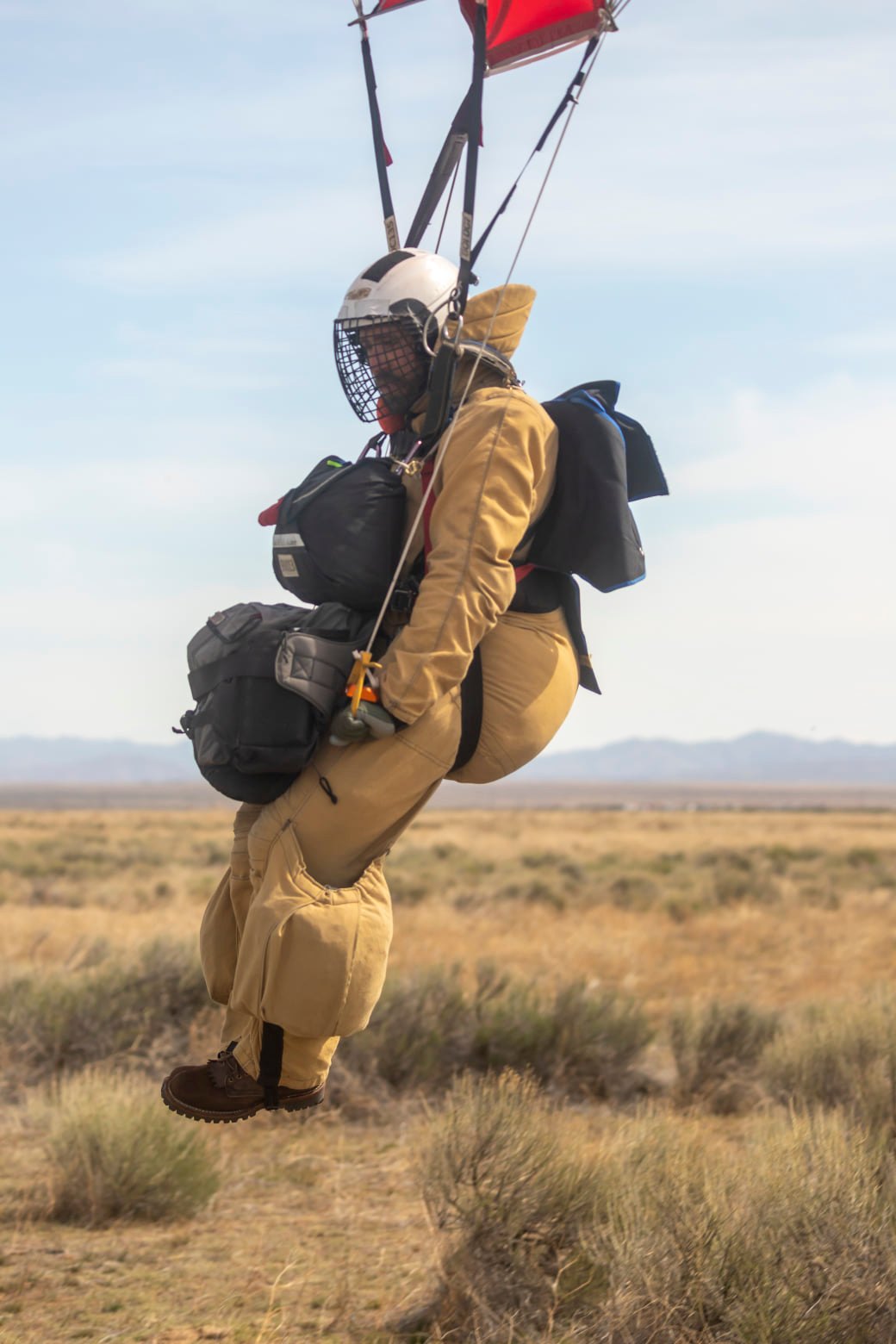 Smokejumper landing on the ground.