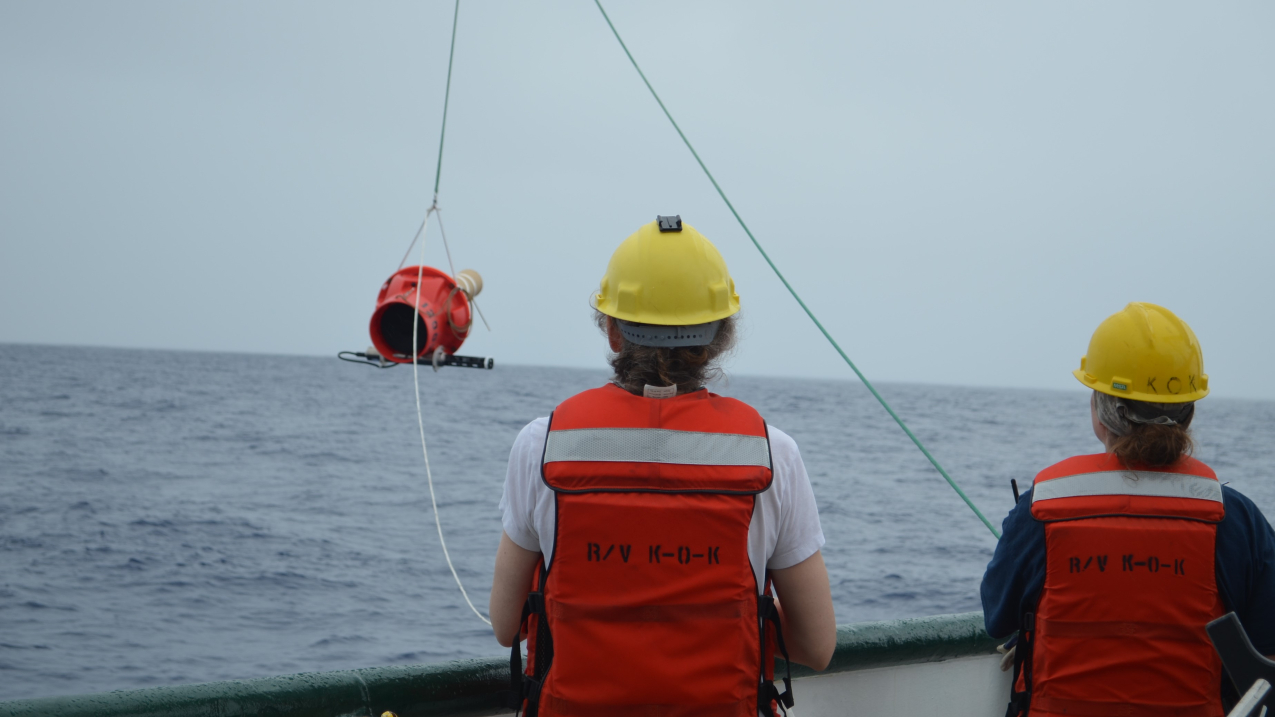 Photo showing NOAA Affiliates Dr. Elizabeth Steffen (left) and Marine Tech Elizabeth Ricci (right) deploy a Deep Sounding Oceanographic Lagrangian Observer (SOLO) Argo float from the R/V Kaʻimikai-O-Kanaloa in 2018.