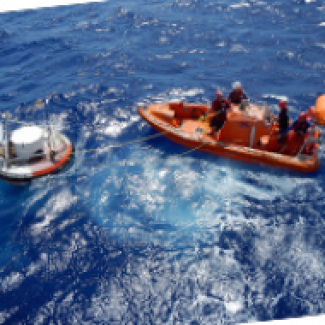 small boat tethered to a buoy