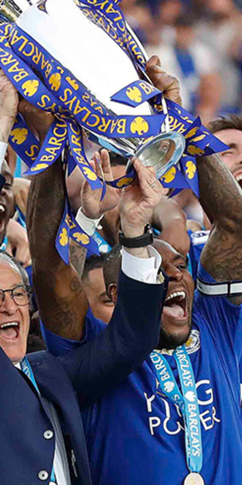 Leicester City team lifting EPL trophy marks one of the Biggest Upsets in Sports Betting History.